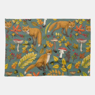 Autumn foxes on pine green tea towel