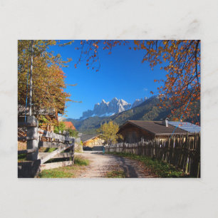 Autumn in a village in the Dolomites in Italy Postcard