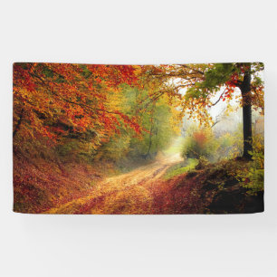 Autumn Leaves and Trees Covering Dirt Road Banner