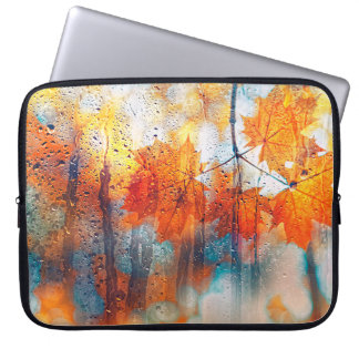 autumn leaves on rainy glass texture. concept of f laptop sleeve