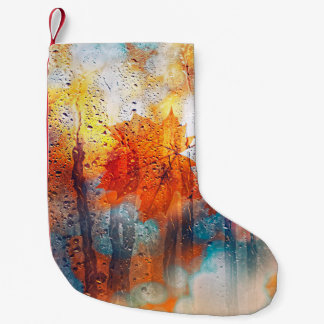 autumn leaves on rainy glass texture. concept of f small christmas stocking