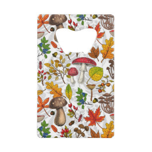 Autumn mushrooms, leaves, nuts and berries on blue