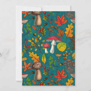 Autumn mushrooms, leaves, nuts and berries on blue