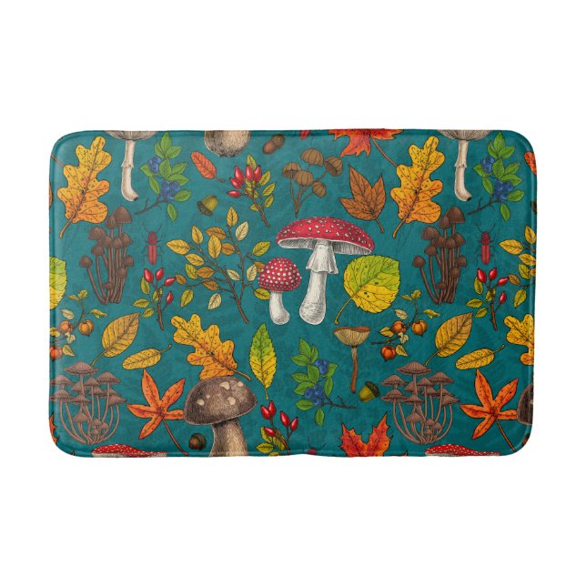 Autumn mushrooms, leaves, nuts and berries on blue bath mat (Front)