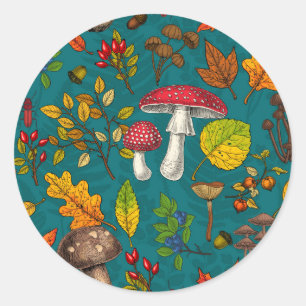 Autumn mushrooms, leaves, nuts and berries on blue classic round sticker
