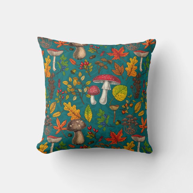 Autumn mushrooms, leaves, nuts and berries on blue cushion (Front)