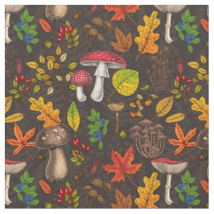 Autumn mushrooms, leaves, nuts and berries on blue fabric