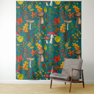 Autumn mushrooms, leaves, nuts and berries on blue tapestry