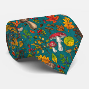 Autumn mushrooms, leaves, nuts and berries on blue tie
