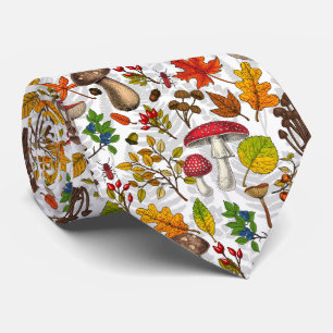 Autumn mushrooms, leaves, nuts and berries on blue tie