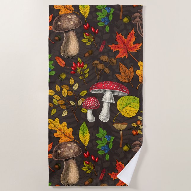 Autumn mushrooms, leaves, nuts and berries on dark beach towel (Front)