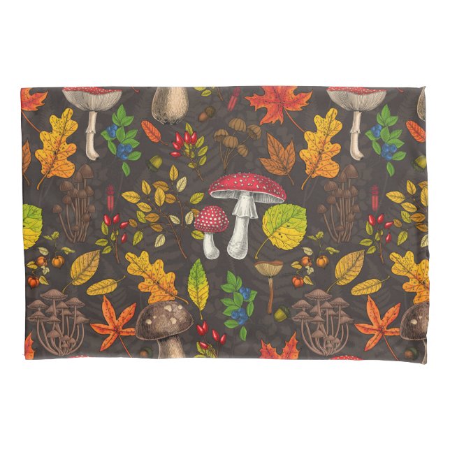 Autumn mushrooms, leaves, nuts and berries on dark pillowcase (Front-Left)
