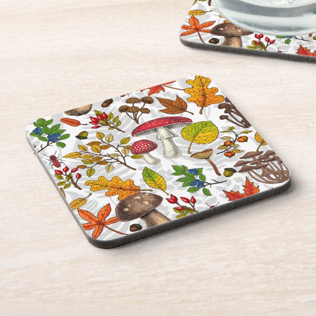 Autumn mushrooms, leaves, nuts and berries on whit coaster (Left Side)