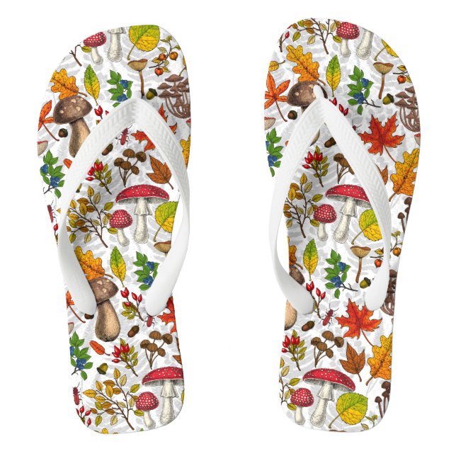 Autumn mushrooms, leaves, nuts and berries on whit flip flops (Footbed)