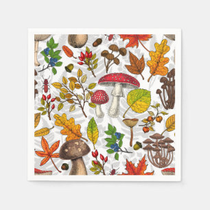 Autumn mushrooms, leaves, nuts and berries on whit napkin