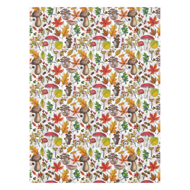 Autumn mushrooms, leaves, nuts and berries on whit tablecloth (Front)