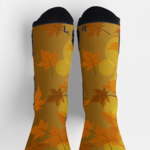 Autumn pattern with falling maple leaves and bokeh socks