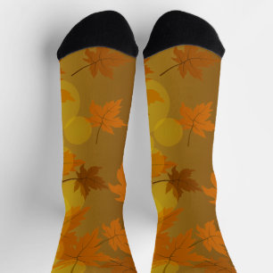 Autumn pattern with falling maple leaves and bokeh socks
