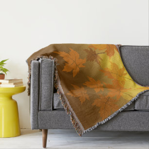 Autumn pattern with falling maple leaves and bokeh throw blanket