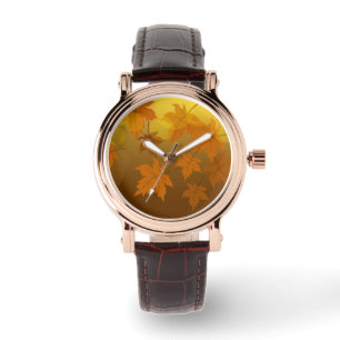 Autumn pattern with falling maple leaves and bokeh watch