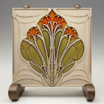 Autumn Petals Art Nouveau Tile<br><div class="desc">Enhance your home with the exquisite beauty of the "Autumn Petals Art Nouveau Ceramic Tile, " a stunning piece that embodies the elegance and organic forms of the Art Nouveau movement. This ceramic tile, printed by Zazzle, features a detailed design of stylised petals in warm shades of orange and green,...</div>