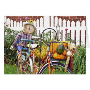 autumn scarecrow on bicycle