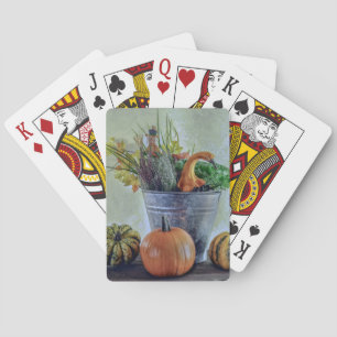 Autumn still life with pumpkins, flowers playing cards