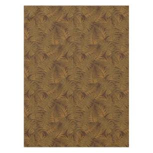Autumnal fern on brown tablecloth