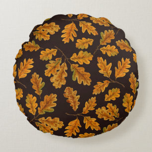 Autumnal oak leaves on dark brown round cushion