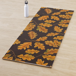 Autumnal oak leaves on dark brown yoga mat