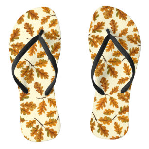 Autumnal oak leaves on off white flip flops