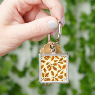Autumnal oak leaves on off white key ring