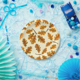 Autumnal oak leaves on off white paper plate