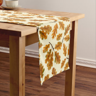 Autumnal oak leaves on off white short table runner