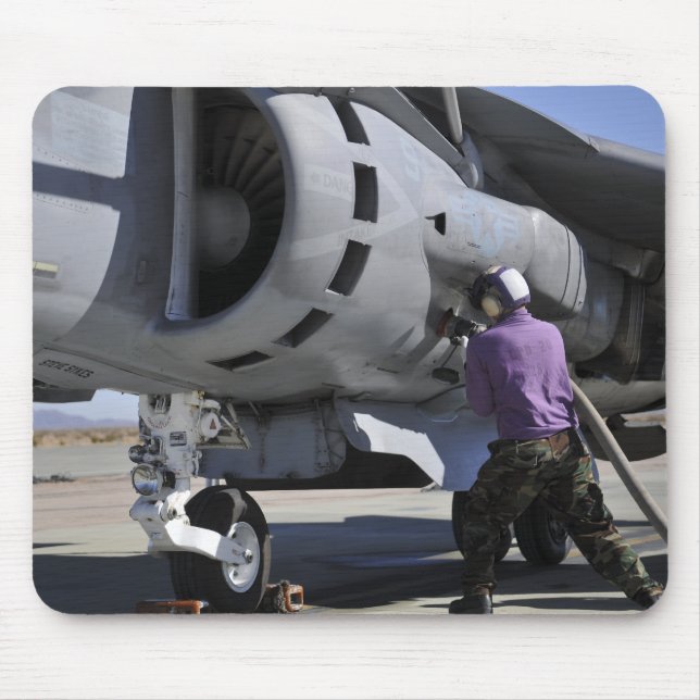 Aviation fuel technician attaches a fuel line mouse mat (Front)