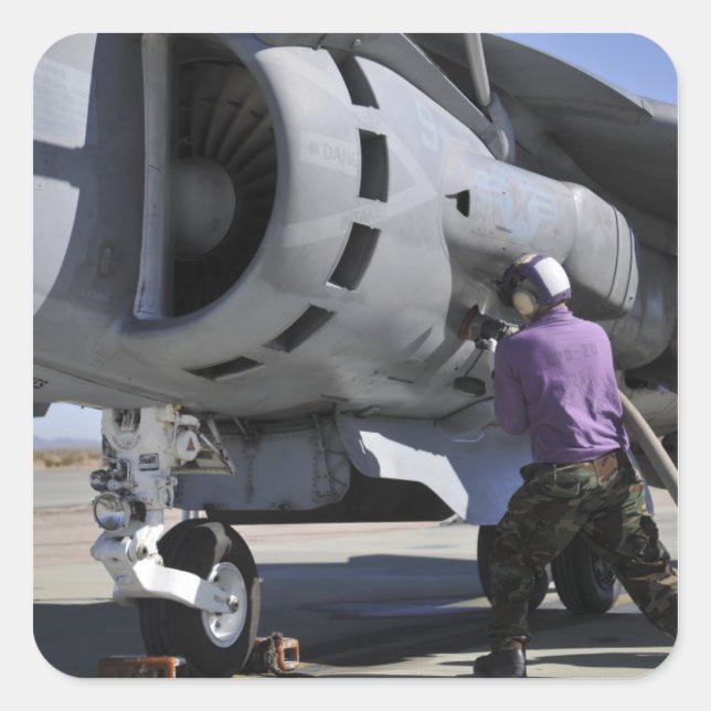Aviation fuel technician attaches a fuel line square sticker (Front)