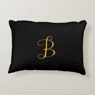 B gold monogram on black decorative cushion