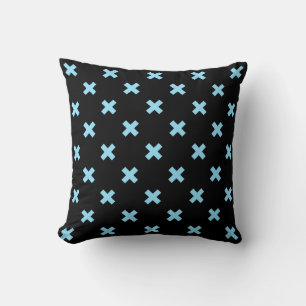 Baby blue cross stitches on black cushion