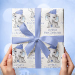 Baby Boy First Christmas Elephant Blue Snow Name Wrapping Paper Sheet<br><div class="desc">Recognise a baby boy's First Christmas with this personalised giftwrap set of 3 sheets featuring a cute watercolor baby boy elephant wearing a blue stocking cap and holding a blue Christmas ornament surrounded by snowflakes with your choice of text (the sample shows NAME'S FIRST CHRISTMAS) in your choice of font...</div>