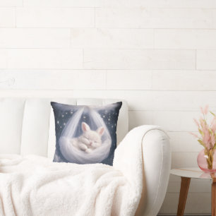 Baby Bunny Hanging from a Tulle Hammock Cushion