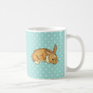 baby bunny on teal polka dot background coffee mug