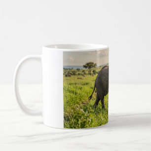 Baby Elephant Walking Through Grass Coffee Mug