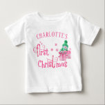 Baby First Christmas Pink Snowman and Snowflakes Baby T-Shirt<br><div class="desc">Personalised First Christmas T-Shirt with a cute snowman and pink, candy cane typography. The wording reads "[your name's] first Christmas" and the template is set up for you to add baby's name. The design features a cartoon snowman with beautifully gift wrapped xmas presents, snowflakes and stars. Lovely top for a...</div>