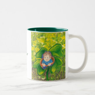 Baby in a clover field. Two-Tone coffee mug