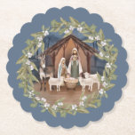 Baby Jesus in the Manger Nativity  Paper Coaster<br><div class="desc">This traditional Christmas coaster features a nativity image of baby Jesus sleeping in a manger with Mary and Joseph in the centre. The nativity is surrounded by a wreath with berries on a blue background.</div>