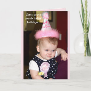 Baby looking grumpy at her first birthday party card