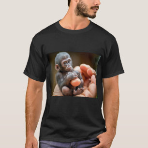"Baby Monkey Sitting Holding Food in Hand Tee"  T-Shirt