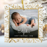 Babys 1st Christmas Photo Gold Foliage White Ceramic Ornament<br><div class="desc">Celebrate baby's first Christmas with this beautiful keepsake ornament. Easily replace the sample image with your own favourite photo and customise it with baby's name in white script font and the year below. A black gradient screen helps make the text pop. The photo is set off by an elegant square...</div>