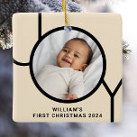 Baby's First Christmas Photo Cream Ceramic Ornament<br><div class="desc">This stylish Baby's First Christmas Photo Ornament is decorated with the word JOY in modern black typography on a cream background.
Easily customisable with your photo,  name,  and year.
It makes a great keepsake!</div>