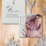 Baby's First Christmas Vertical Photo Snowflake Ce Ceramic Ornament<br><div class="desc">Baby's First Christmas photo ornament with vertical photo, elegant calligraphy and delicate white snowflakes on a silver grey border. The photo template is ready for you to add your photo, baby's name, the year and your custom text on the back. With the exception of the handwritten text used for Baby's,...</div>